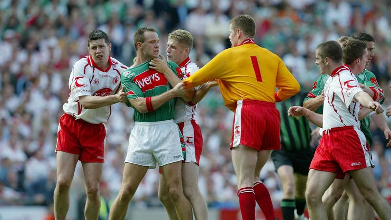 David Brady gets to grip with Tyrone in the 2004 All-Ireland quarter-finals. Photograph: Morgan Treacy/Inpho