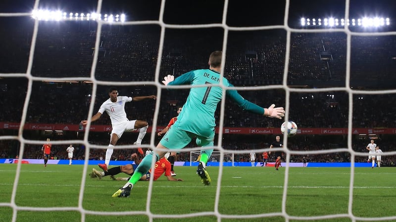 England’s Marcus Rashford scores past David De Gea. Photo: Nick Potts/PA Wire