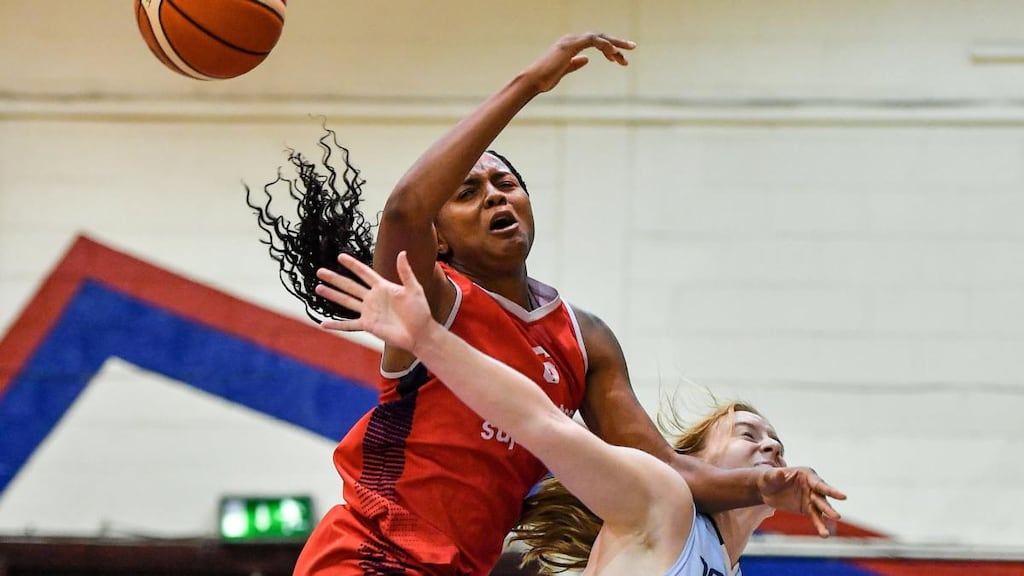 Aryn McClure of Singleton SuperValu Brunell in action against Ashley Russell of DCU Mercy during their Hula Hoops National Cup semi-final match at Neptune Stadium in Cork. Photograph: Brendan Moran/Sportsfile