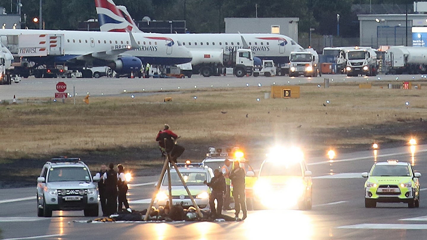 Handout photo issued by Black Lives Matter UK of protesters on the runway at London City Airport. Photograph: PA
