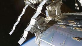 Spacewalking astronauts repair space station leak