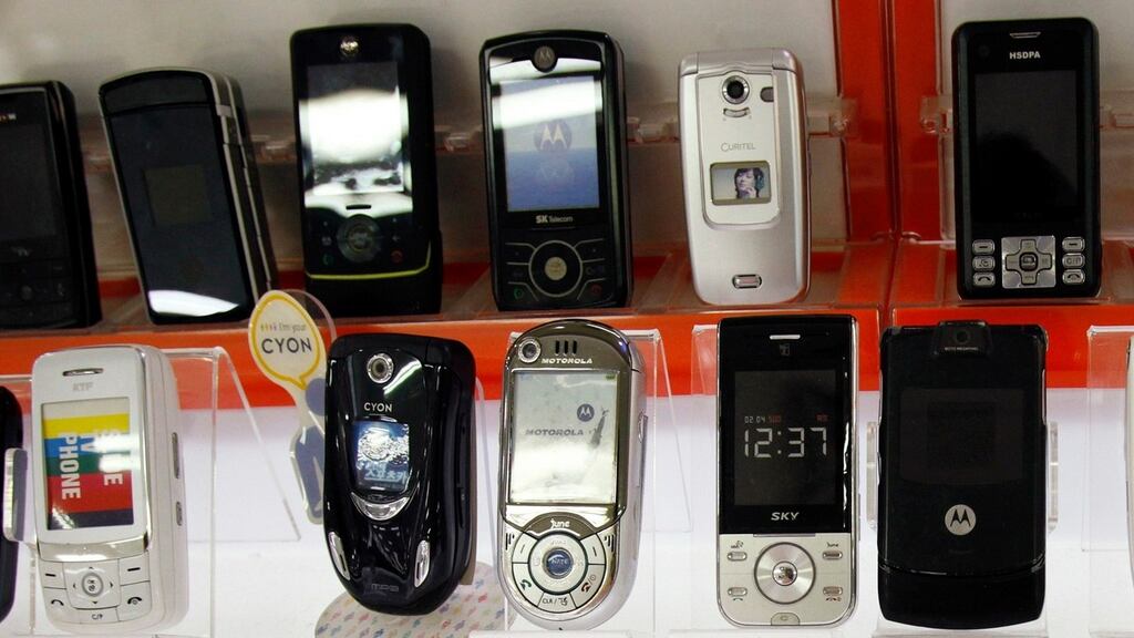 Mobile phones seen on display in a shop. Gardai said 1,000 smartphones have been stolen in Dublin city centre since the start of the year. Photograph: Reuters