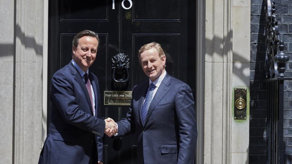 Taoiseach Enda Kenny is greeted by British Prime Minister David Cameron on the steps of 10 Downing Street ahead of their meeting. Photograph: Niklas Halle’n/AFP/Getty Images