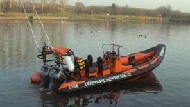 Fisherman and his dog rescued after four hours in water