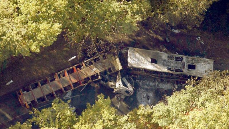 An aerial view of the site where a coach (right) carrying members of an elderly people’s club collided with a truck outside Puisseguin near Bordeaux, western France. Photograph: Regis Duvignau/Reuters