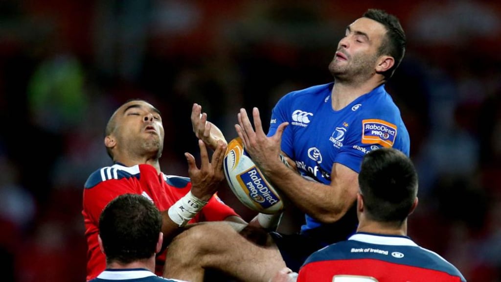 Simon Zebo of Munster and Dave Kearney of Leinster contest a high ball during Saturday’s Pro12 match at Thomond Park. Photograph: Ryan Byrne/Inpho.