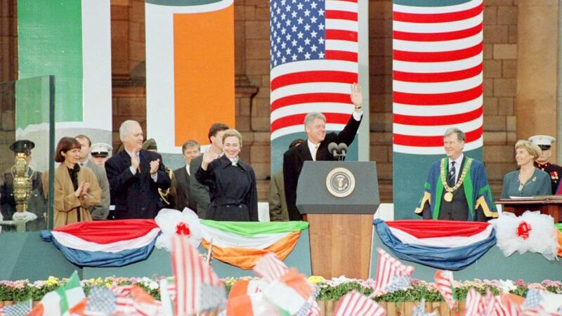 US president Bill Clinton waves to an estimated crowd of 100,000 who crammed Dublin’s city centre in honour of his peace drive in December 1995.