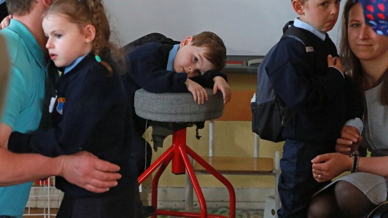 Scott Fagan having a little rest before class began on his  first day at school piece at St Olaf’s NS, Balally Drive, Dundrum, Dublin 16.  Photograph: Nick Bradshaw