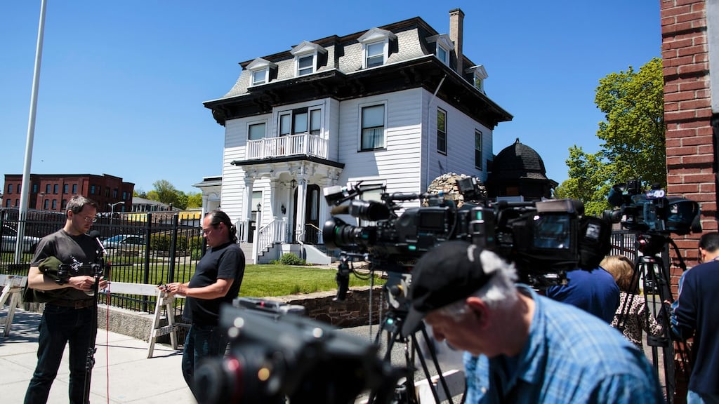 Reporters outside the Graham Putnam & Mahoney Funeral Parlor in Worcester where the body of Tamerlan Tsarnaev, one of the two suspects in the Boston Marathon bombings, was being held while a burial place was sought. Photograph: Evan McGlinn/New York Times.