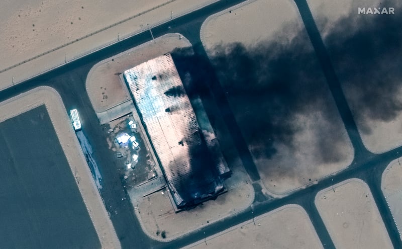 A burning building at Merowe Airbase. Photograph: Maxar Technologies via AP