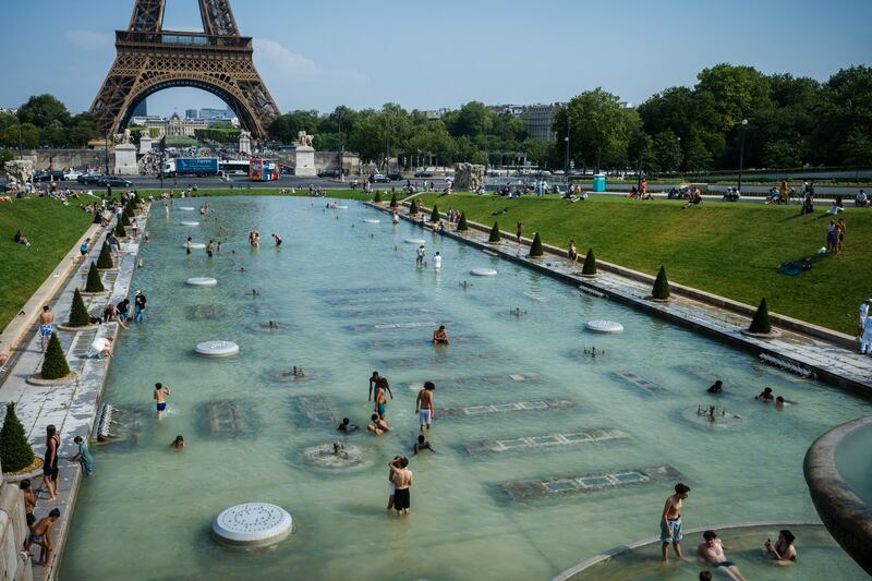 People cool off in the Trocadero Fountain in front of the Eiffel Tower in Paris on Wednesday. Photograph: Dimitar Dilkoff/AFP via Getty Images
