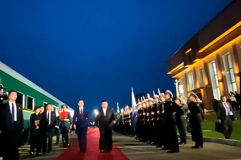 Kim Jong-un (centre right) attends a welcome ceremony on his arrival in Russia. Photograph: AP