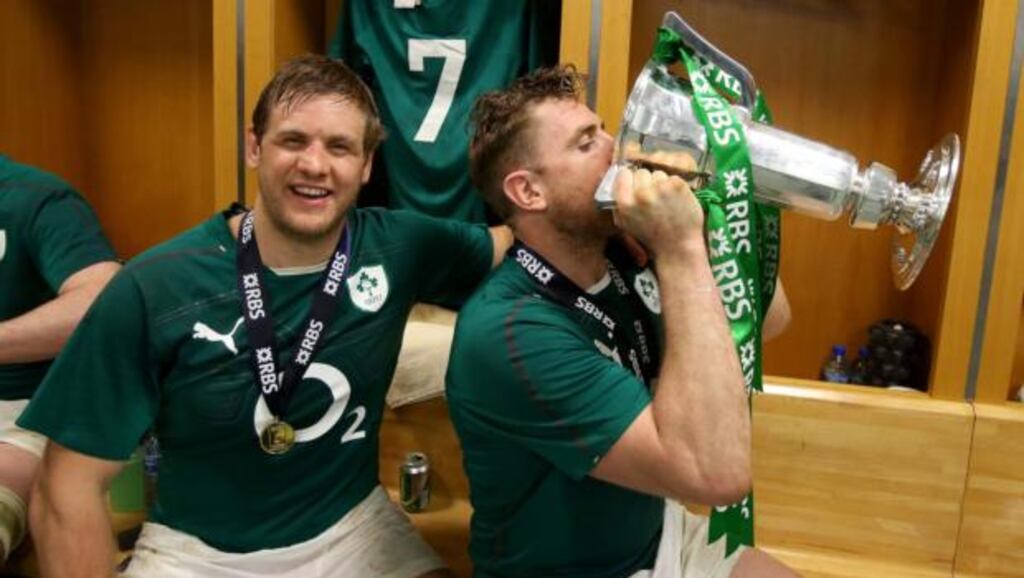 Ireland’s Chris Henry and Jamie Heaslip (right) celebrate in the dressing room after the win over France in Paris. Photograph: Dan Sheridan/Inpho