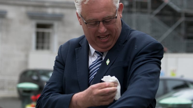 Sinn Féin spokesperson on addiction, recovery and wellbeing Thomas Gould TD wipes bird poo from his suit during the launch of his party’s Community Addiction and Recovery Strategy. Photograph: Gareth Chaney/Collins