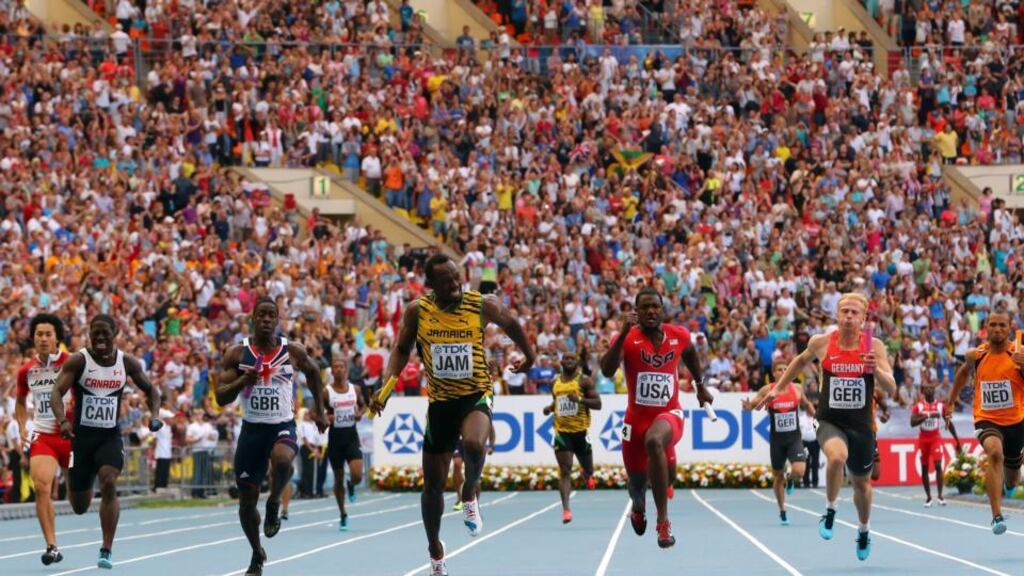Usain Bolt of Jamaica (C) crosses the line first to win a third gold medal this time in the Men’s 4x100 metres final during Day Nine of the 14th IAAF World Athletics Championships in Moscow. Photograph: Jamie Squire/Getty Images