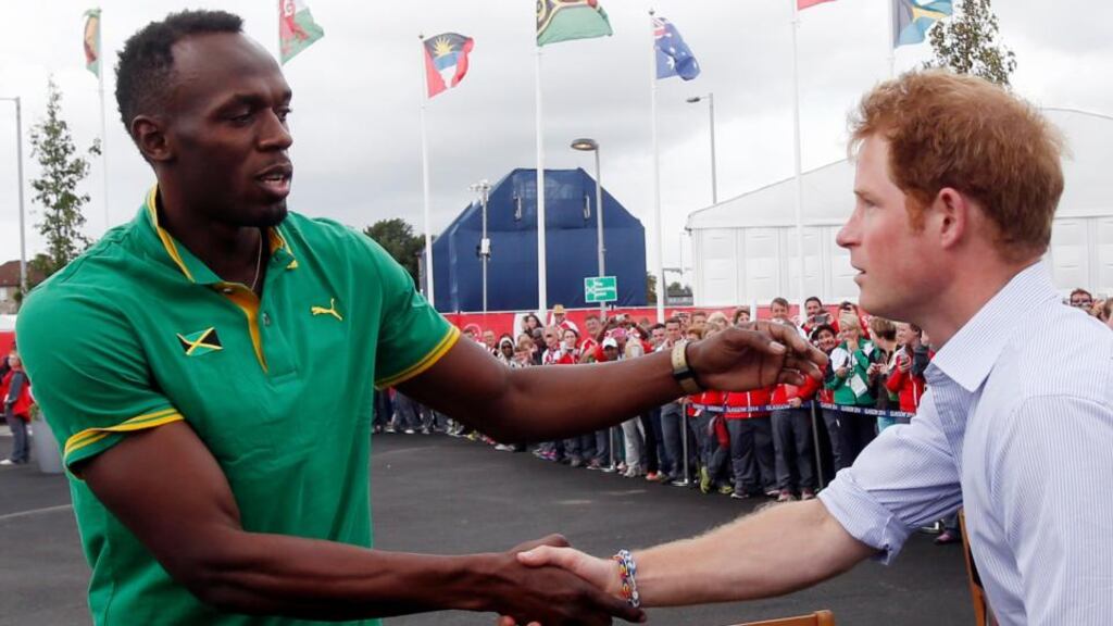 A royal welcome for Usian Bolt from Prince Harry at Celtic Park. However the Olympic sprint champion may needa royal pardon after criticisng the Commonwealth Games. Photograph: Danny Lawson/PA Wire