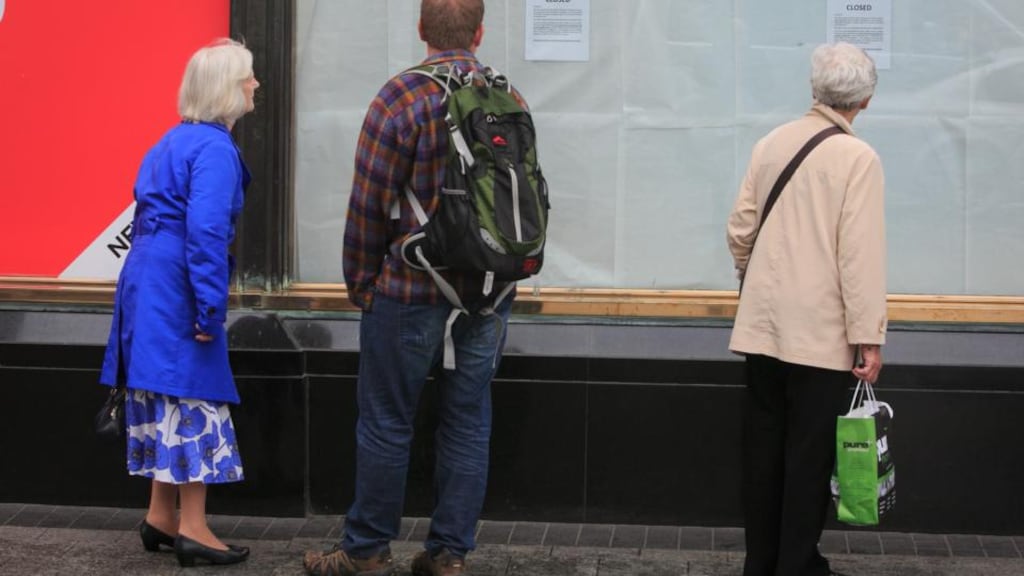 Members of the public view a closed notice at Clerys following the sudden closure of the department store on O’Connell Street, Dublin. Photograph: Gareth Chaney Collins