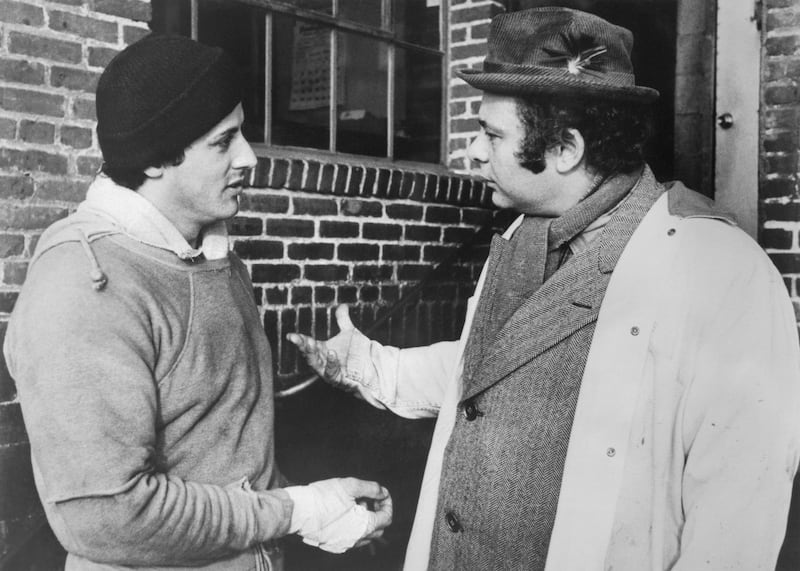 (Original Caption) Rocky, Sylvester Stallone, at left, discusses his forthcoming match for the world championship with his best friend Paulie, (Burt Young). Photograph: Bettmann