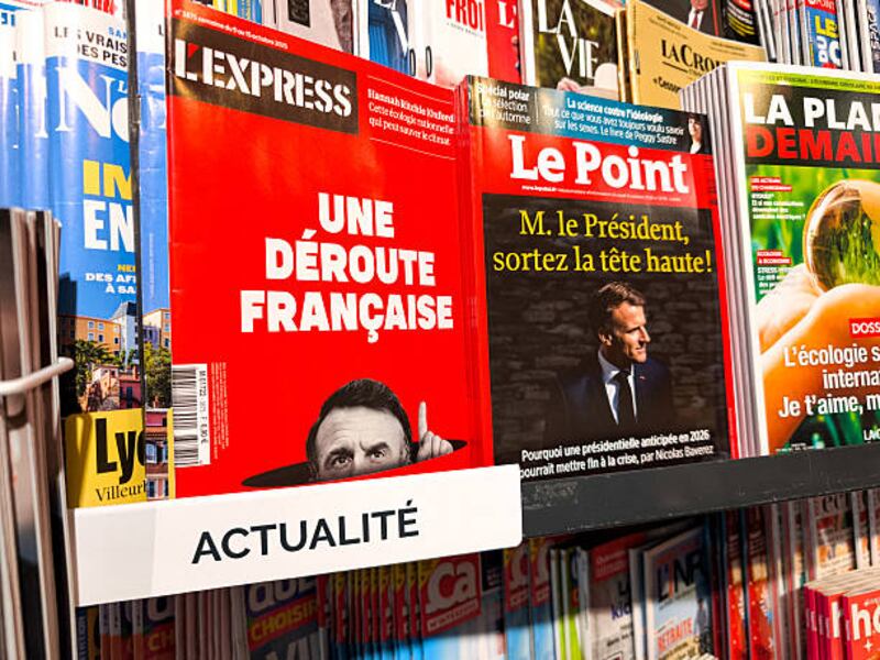 The cover of Le Point with the title 'Mr President, come out with your head held high', next to the cover of L Express with the title, "A French Rout". Photograph: Nicolas Guyonnet / Hans Lucas/AFP/Getty Images