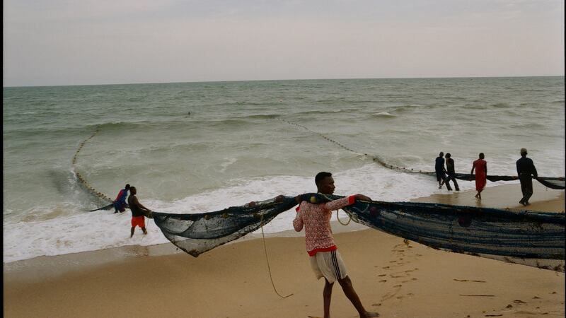 Fishermen hauling in their nets – on the beach near the village of Keta