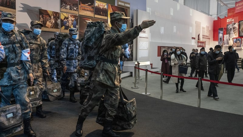 Patrons visit an exhibit about the People’s Liberation Army’s role in the battle against Covid at an exhibition centre that had served as a temporary hospital during the outbreak in Wuhan. Photograph: Gilles Sabrie/The New York Times