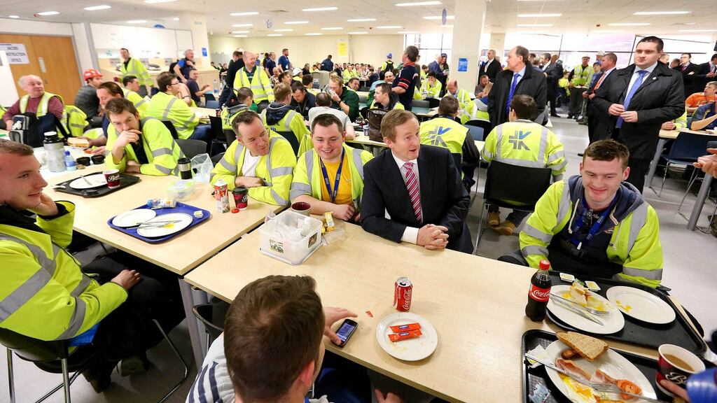 Taoiseach Enda Kenny with some of the construction workers on his tour of Intel today. Photograph: Marc O’Sullivan