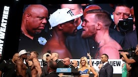 McGregor makes weight; Mayweather makes promise fight won’t go distance