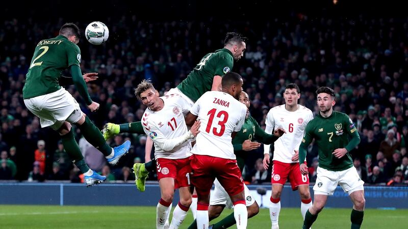 Matt Doherty heads home a goal during the Euro 2020 qualifier against Denmark at the Aviva stadium last November. Photograph:  Niall Carson/PA Wire
