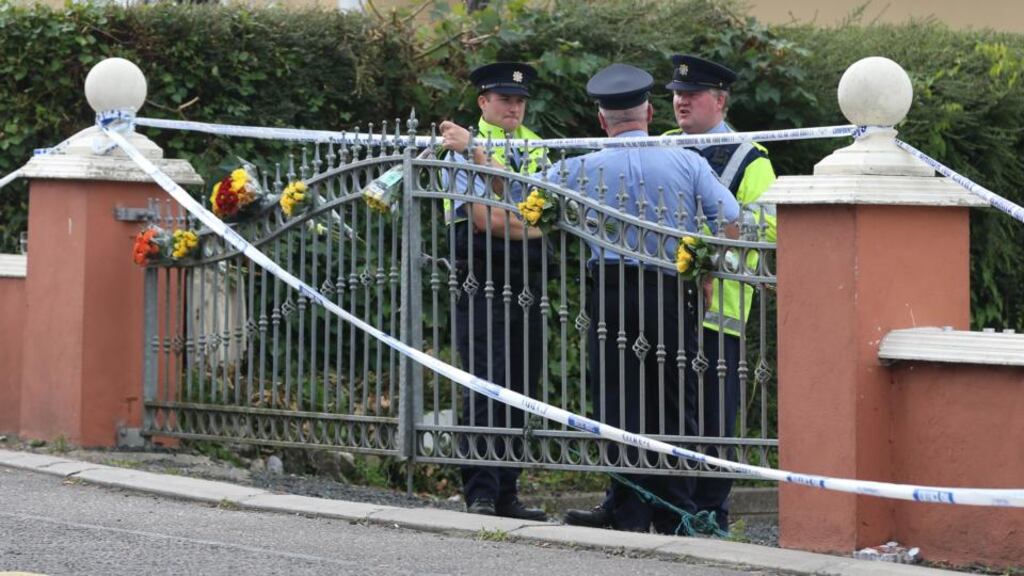 Gardaí at the scene where two children were found dead in Charleville, Co Cork. Photograph: Niall Carson/PA Wire