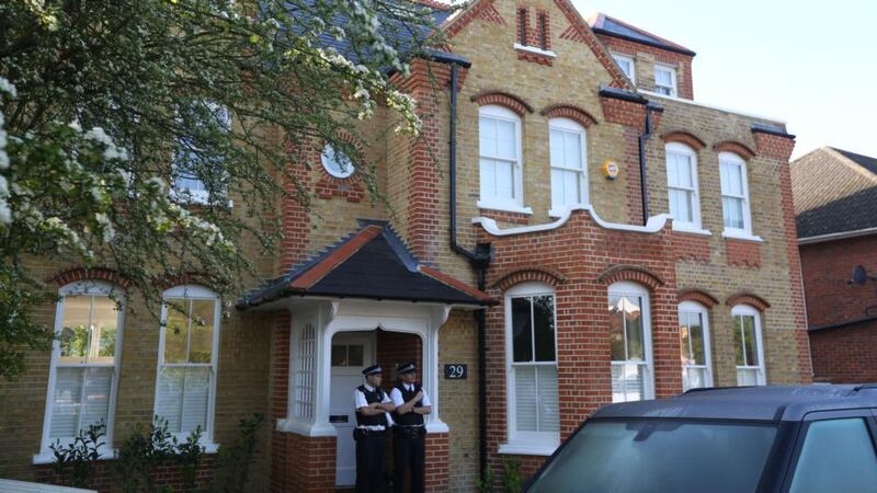 Police at the London house where a woman was arrested after the discovery of three dead children. Photograph: PA