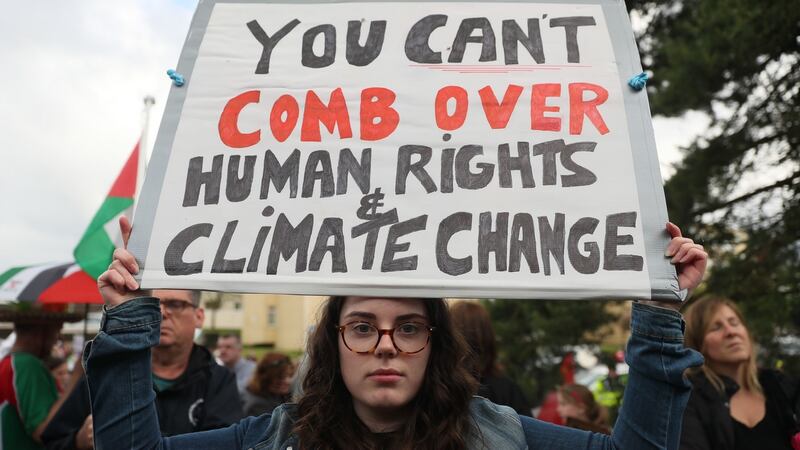 Protesters stand at the peace camp on the road to Shannon Airport following the arrival of US president Donald Trump. Photograph: Brian Lawless/PA Wire
