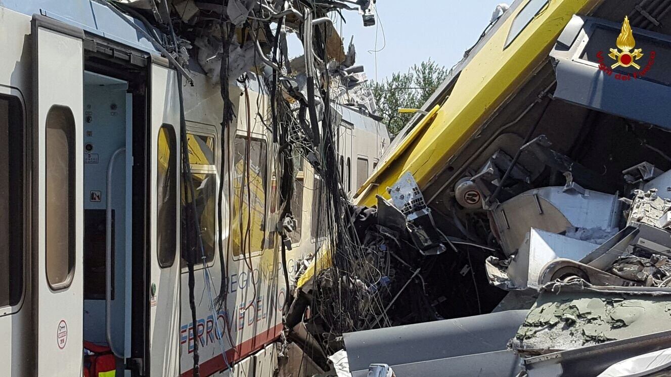 Two passenger trains are seen after a collision Photograph: Italian Firefighters/Reuters
