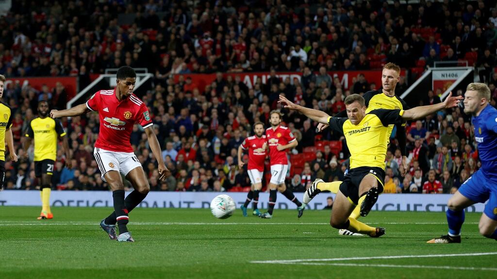Manchester United’s Marcus Rashford opens the scoring in the Carabao Cup third round game against Burton Albion at Old Trafford. Photograph: Andrew Yates/Reuters
