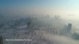 Dense fog creates mysterious city landscape