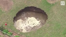 Elderly couple wake to find enormous sinkhole in back garden