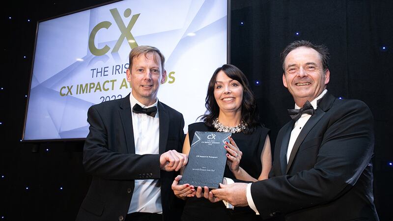Jenny McCoy, awards judge, presents the CX Impact in Transport award to Ronan Murphy & Liam Kenny, Iarnród Éireann Irish Rail.
