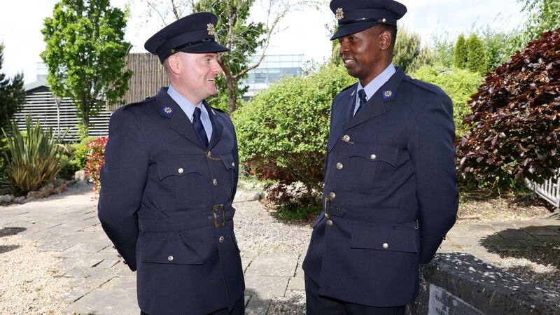 Newly graduated gardaí Tom Campbell and  Aristides Lucau at  Templemore on Thursday. Photograph : Laura Hutton / The Irish Times
