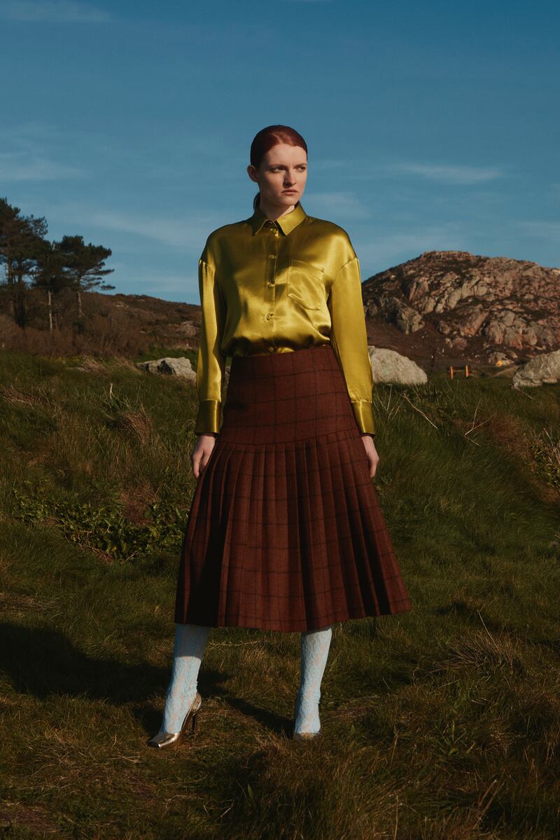 Aoife: Long-sleeved relaxed shirt in pistachio green, €285; textured pleated wool tailored skirt in chocolate brown, €590.