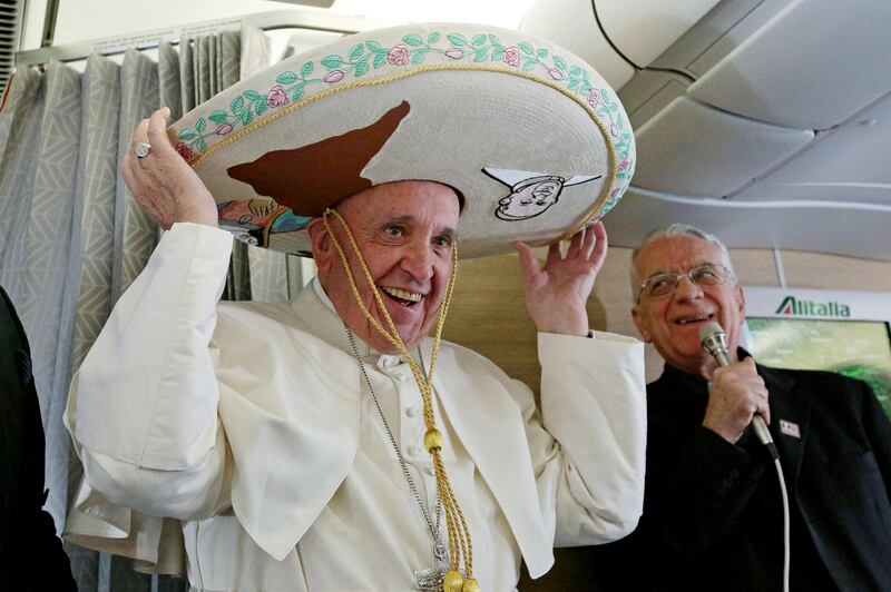 2016. Pope Francis wears a traditional Mexican sombrero hat received as a gift by a Mexican journalist on February 12, 2016, aboard the plane to Havana. Photograph: Alessandro Di Meo/AFP via Getty Images        