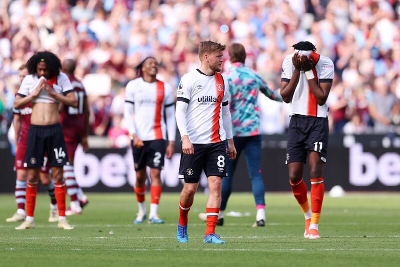 Luke Berry of Luton Town and team mate Elijah Adebayo react to their defeat to West Ham. Photograph: Richard Pelham/Getty Images