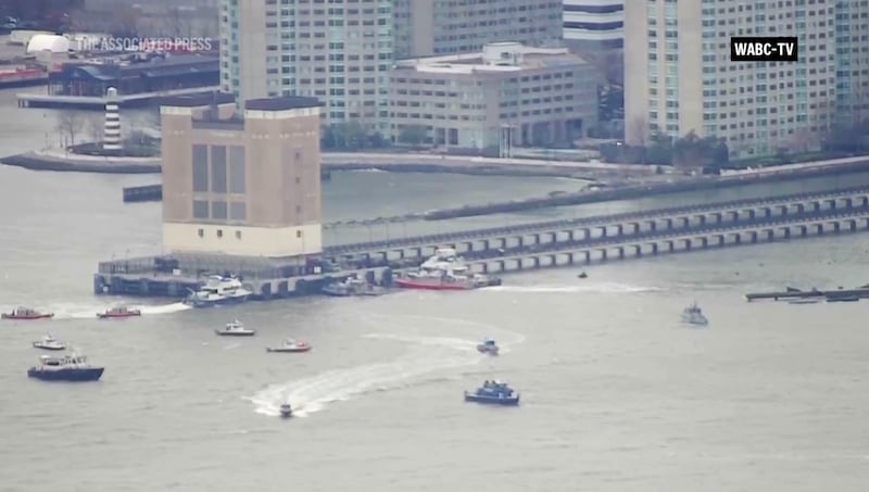 An aerial image taken from video shows rescue vessels at the site of the helicopter crash on the Hudson river in New York on Thursday. Photograph: WABC-TV via AP