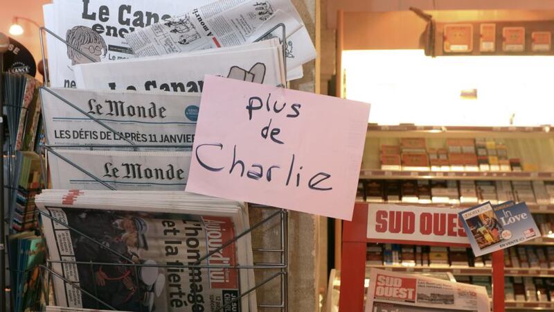 A sign which translates as “Charlie Hebdo - Sold Out” is displayed at a newsagents in Bordeaux. Photograph: AFP/Getty/Hean Pierre Muller.