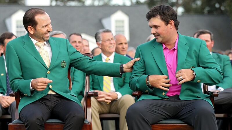 Patrick Reed laughs with Sergio Garcia  after being presented with the green jacket in honour of winning the 2018 Masters. Photograph:   Patrick Smith/Getty Images
