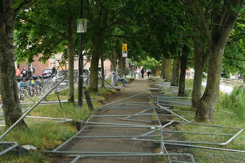 Fencing on the Grand Canal that was erected to prevent tents being pitched has been dismantled by protesters.  Photograh: Enda O'Dowd