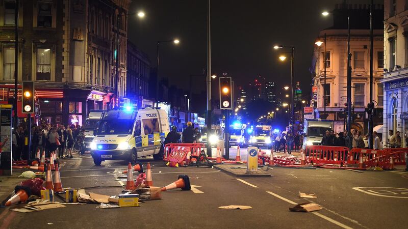 Riot police at a protest in Kingsland Road in east London, where people gathered in response to the death of Rashan Charles. Photograph: Lauren Hurley/PA Wire