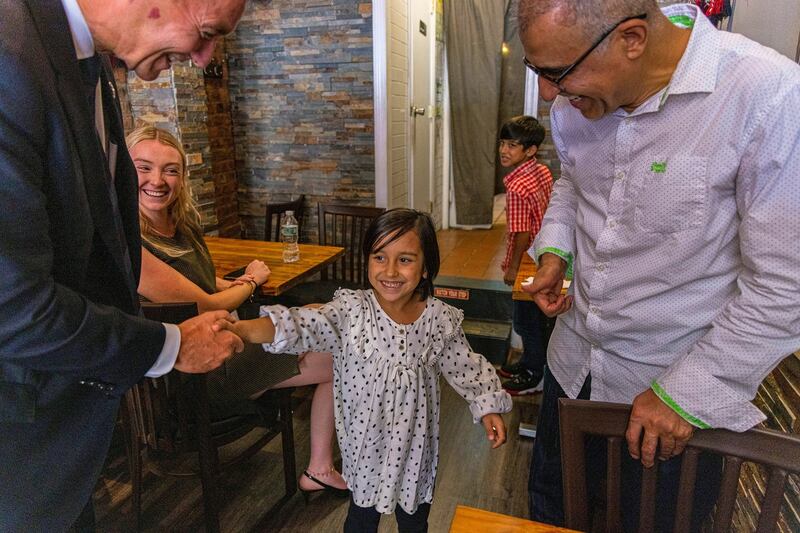 New York representative Tom Suozzi greets the children of Mohammad Wali, after he helped evacuate them from Kabul. Photograph: Hiroko Masuike/New York Times
