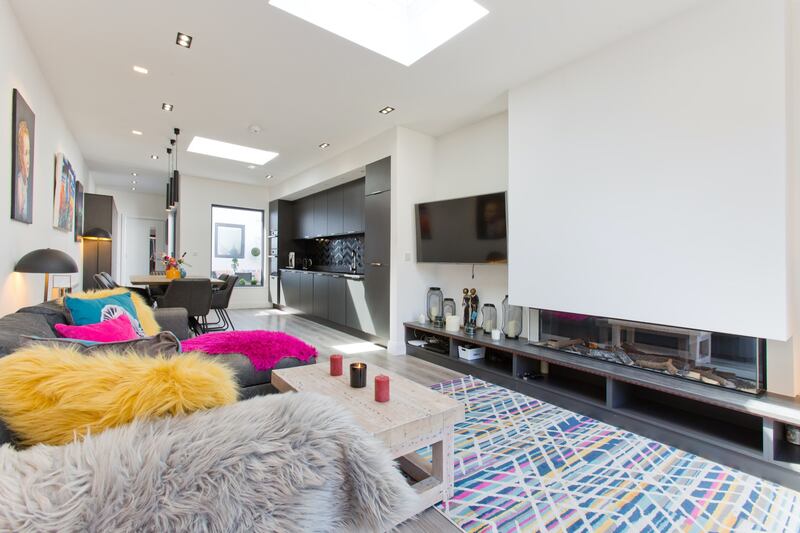 The living room extends into the kitchen in an open plan.