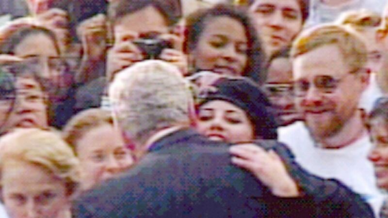 US president Bill Clinton embraces Monica Lewinsky in a crowd outside the White House in a scene which has become one of the most prominent images of the sex scandal. Photograph: Larry Downing/ Reuters