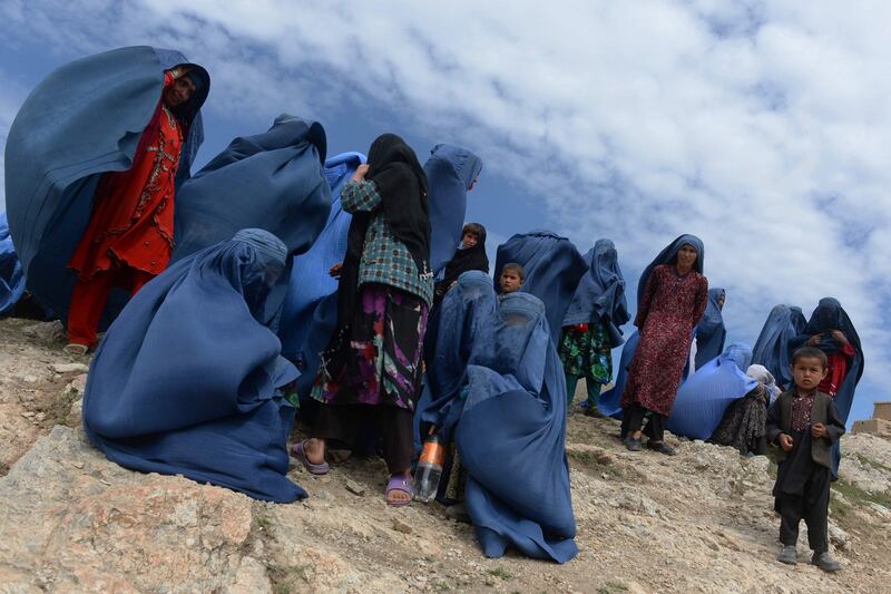 May 5th, 2014: Afghan villagers are pictured near the scene in the landslide-hit Aab Bareek village in Argo district of Badakhshan province. Photograph: Shah Marai/AFP