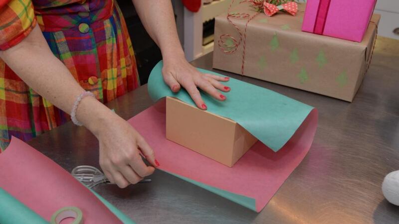 Step 3: The bit of tape you’ve used will get the gift to stay in place while you continue wrapping.  Photograph: Alan Betson